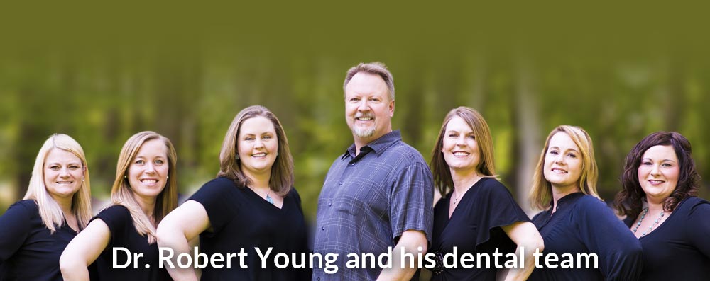 Dr. Robert M. Young and his dental team
